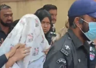 anmol alias pinky being escorted to the judicial complex for her hearing under a white garb on monday photo express