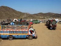 trucks transporting afghan nationals who were expelled from pakistan are parked as refugees wait for registration at the omari refugee camp in mohmand dara torkham border nangarhar province afghanistan april 15 2025 photo reuters