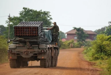 a cambodian military personnel gestures from a bm 21 grad multiple rocket launcher around 40 km 24 miles from the disputed ta moan thom temple after thailand and cambodia exchanged heavy artillery on friday as their worst fighting in more than a decade stretched for a second day in oddar meanchey province cambodia july 25 2025 reuters soveit yarn