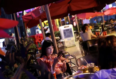 screengrab of customers dine at a restaurant in a shopping area of beijing china july 25 2022 reuters