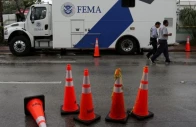 rescue personnel walk in front of a fema truck in surfside near miami beach florida u s june 30 2021 photo reuters