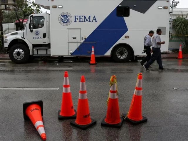rescue personnel walk in front of a fema truck in surfside near miami beach florida u s june 30 2021 photo reuters rescue personnel walk in front of a fema truck in surfside near miami beach florida u s june 30 2021 photo reuters