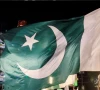 people wave national flags as they gather on the eve of independence day in lahore on august 13 2025 photo reuters
