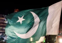 people wave national flags as they gather on the eve of independence day in lahore on august 13 2025 photo reuters