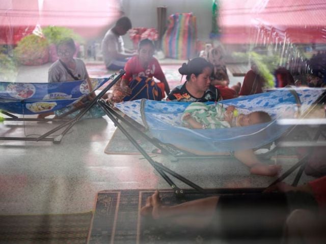 People rest inside a temporary shelter in Srisaket province, after Thailand and Cambodia exchanged heavy artillery fire for a second day on Friday as border fighting intensified and spread, while Cambodia's leader said Thailand had agreed to a Malaysian ceasefire proposal but then backed down, Thailand, July 26, 2025. Source: Reuters