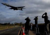 people use their cameras as a usaf b 1 bomber approaches to land at raf fairford airbase used by united states air force usaf personnel amid the us israeli war on iran photo reuters
