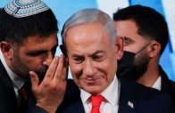 an aide speaks to israeli prime minister and likud party leader benjamin netanyahu as he gives a statement following exit polls for israel s national election at likud s election headquarters in jerusalem october 28 2026 photo reuters
