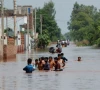 residents wade through a flooded road following monsoon rains and rising water levels in qadirabad village near the chenab river in punjab province pakistan august 28 2025 photo reuters