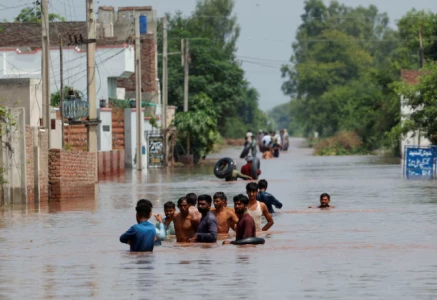 residents wade through a flooded road following monsoon rains and rising water levels in qadirabad village near the chenab river in punjab province pakistan august 28 2025 photo reuters residents wade through a flooded road following monsoon rains and rising water levels in qadirabad village near the chenab river in punjab province pakistan august 28 2025 photo reuters