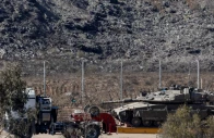 a truck transports a tank on the israeli side of the border with gaza in israel october 19 2025 photo reuters a truck transports a tank on the israeli side of the border with gaza in israel october 19 2025 photo reuters
