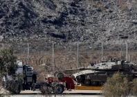 a truck transports a tank on the israeli side of the border with gaza in israel october 19 2025 photo reuters a truck transports a tank on the israeli side of the border with gaza in israel october 19 2025 photo reuters