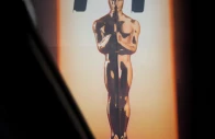 screegrab of a large billboard sign featuring an oscar statuette towers over hollywood blvd reuters