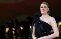 screengrab of cast member greta gerwig poses on the red carpet for the screening of the movie jay kelly reuters