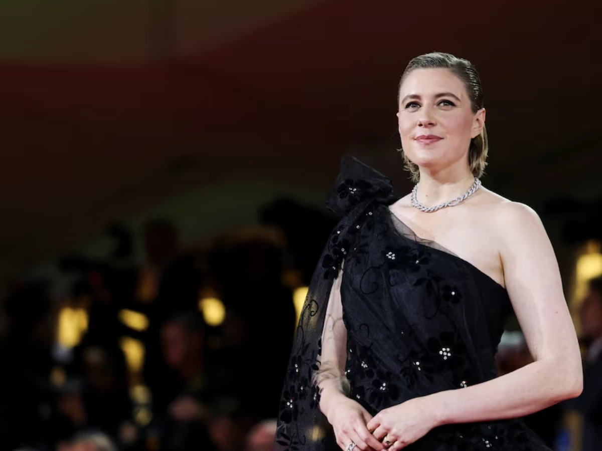 screengrab of cast member greta gerwig poses on the red carpet for the screening of the movie jay kelly reuters