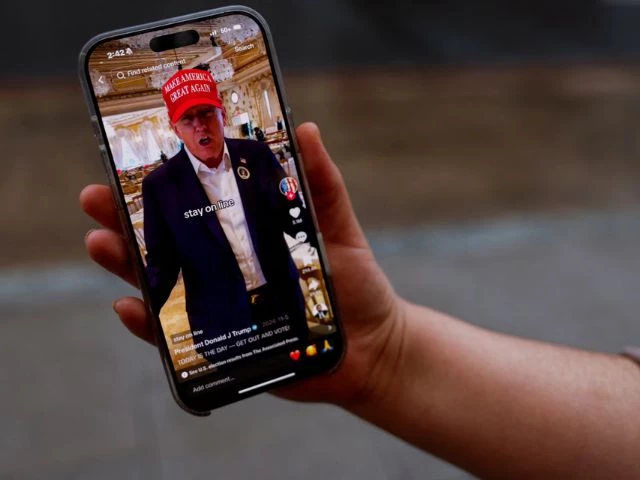 woman poses with her smartphone displaying the realdonaldtrump tiktok page in washington u s january 19 2025 photo reuters woman poses with her smartphone displaying the realdonaldtrump tiktok page in washington u s january 19 2025 photo reuters