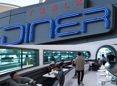 elon musk launches tesla diner with ev charging and rooftop movies