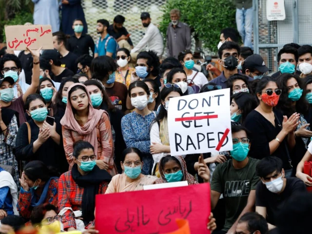 people carry signs against a gang rape that occurred along a highway and to condemn violence against women and girls during a protest in karachi pakistan september 12 2020 photo reuters