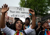 people sing during a protest following the death of yves sakila a congolese born man who died after being restrained by security guards outside a department store outside leinster house in dublin ireland may 21 2026 photo reuters