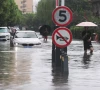 people wade through a flooded street after typhoon dolphin brought heavy rain to shanghai china august 10 2026 photo reuters
