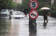 people wade through a flooded street after typhoon dolphin brought heavy rain to shanghai china august 10 2026 photo reuters people wade through a flooded street after typhoon dolphin brought heavy rain to shanghai china august 10 2026 photo reuters