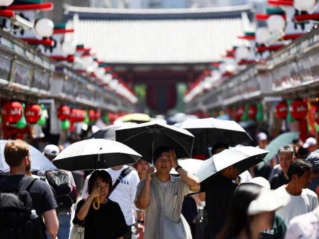 visitors holding parasols walk along nakamise street at the asakusa district a popular sightseeing spot as the japanese government issued a heatstroke alert in tokyo and other prefectures due to a heatwave in tokyo japan august 5 2025 photo reuters visitors holding parasols walk along nakamise street at the asakusa district a popular sightseeing spot as the japanese government issued a heatstroke alert in tokyo and other prefectures due to a heatwave in tokyo japan august 5 2025 photo reuters