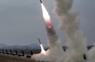 a test launch of 600 mm calibre multiple rocket launchers is overseen by north korean leader kim jong un not pictured north korea march 14 2026 in this picture released by north korea s official korean central news agency photo reuters