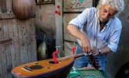photo palestinian craftsman suhail abu shawish repairing damaged ouds afp