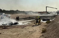 firefighters work at the site of a crash involving an indian made hal tejas fighter jet at the dubai air show united arab emirates november 21 2025 in this handout picture obtained from social media government of dubai media office handout