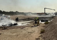 firefighters work at the site of a crash involving an indian made hal tejas fighter jet at the dubai air show united arab emirates november 21 2025 in this handout picture obtained from social media government of dubai media office handout