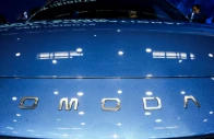 a logo of chery s brand omoda appears on a car as people sit inside at the company s booth at the beijing international automotive exhibition auto china in beijing april 24 2026 photo reuters