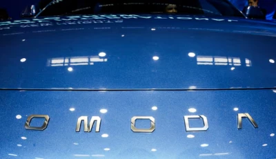 a logo of chery s brand omoda appears on a car as people sit inside at the company s booth at the beijing international automotive exhibition auto china in beijing april 24 2026 photo reuters