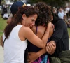 people embrace as they visit a makeshift memorial following the attack on a jewish holiday celebration at sydney s bondi beach in sydney australia december 15 2025 photo reuters