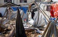 a woman stands near destroyed tents sheltering already displaced palestinians following an overnight israeli strike on a medicine warehouse according to medics in deir al balah in the central gaza strip august 1 2026 photo reuters
