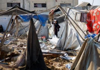 a woman stands near destroyed tents sheltering already displaced palestinians following an overnight israeli strike on a medicine warehouse according to medics in deir al balah in the central gaza strip august 1 2026 photo reuters
