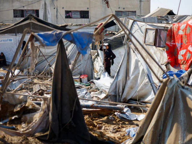 a woman stands near destroyed tents sheltering already displaced palestinians following an overnight israeli strike on a medicine warehouse according to medics in deir al balah in the central gaza strip august 1 2026 photo reuters a woman stands near destroyed tents sheltering already displaced palestinians following an overnight israeli strike on a medicine warehouse according to medics in deir al balah in the central gaza strip august 1 2026 photo reuters