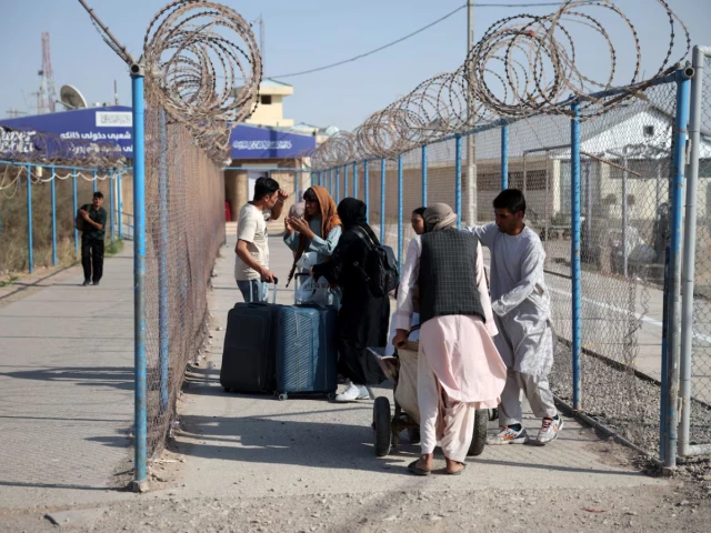 Impoverished by war in Iran, Afghan migrants return to Taliban rule