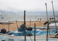 fishing boats rest on the sand after being pulled from the sea as hurricane trudy moves parallel to mexico s pacific coast threatening more rain and strong winds after recent deadly storms in acapulco mexico october 15 2026 photo reuters