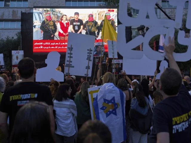 people watch a live broadcast of israeli american soldier edan alexander as he is released from hamas captivity in gaza at a plaza known as the hostages square in tel aviv monday may 12 2025 alexander was abducted during the hamas led attack on his base on october 7 2023 ap photo oded balilty people watch a live broadcast of israeli american soldier edan alexander as he is released from hamas captivity in gaza at a plaza known as the hostages square in tel aviv photo a people watch a live broadcast of israeli american soldier edan alexander as he is released from hamas captivity in gaza at a plaza known as the hostages square in tel aviv monday may 12 2025 alexander was abducted during the hamas led attack on his base on october 7 2023 ap photo oded balilty people watch a live broadcast of israeli american soldier edan alexander as he is released from hamas captivity in gaza at a plaza known as the hostages square in tel aviv photo a