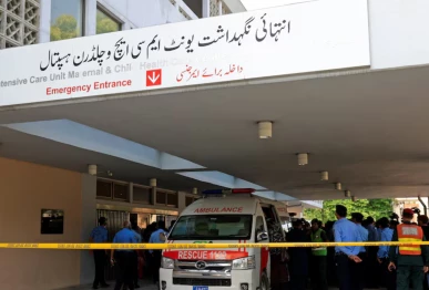 police officers move past an ambulance outside an intensive care unit after a fire broke out at the pakistan institute of medical sciences pims hospital in islamabad pakistan photo reuters