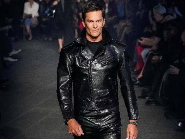 Photo:  Former U.S. football player Tom Brady presents a creation from the Gucci cruise 2027 collection/Reuters
