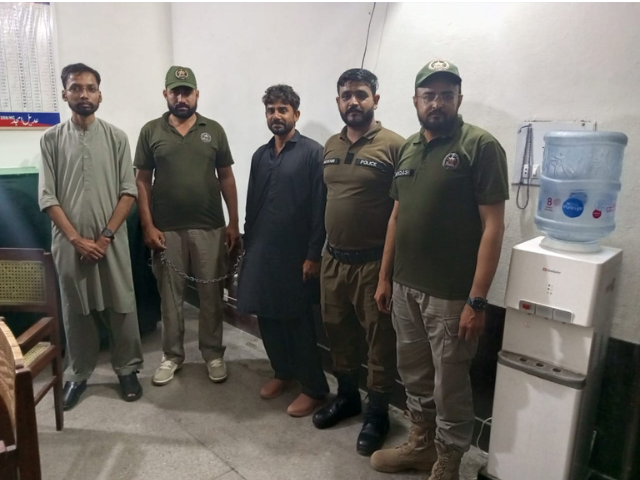 Punjab Wildlife Department officials detain a suspected poacher during an action against illegal hunting of falcons and quails. Photo: Express