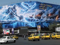people drive past a billboard about the strait of hormuz on a building in tehran iran september 16 2026 photo anadolu agency