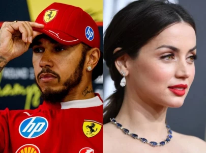 lewis hamilton shares a moment with ana de armas at ferrari garage lewis hamilton shares a moment with ana de armas at ferrari garage