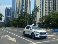 a driverless car by apollo go baidu s robotaxi service drives past another apollo go robotaxi parked on the side of a road in wuhan hubei province china july 19 2024 photo reuters