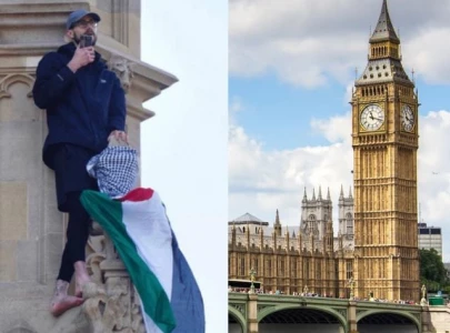 protester detained after 16 hour standoff on big ben with palestinian flag