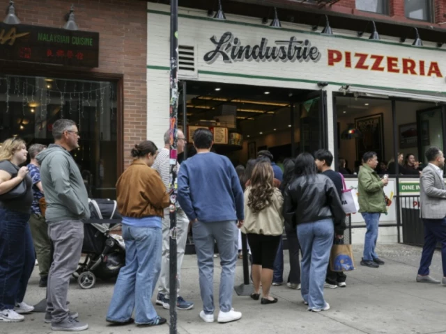 In New York, waiting in line becomes a social scene