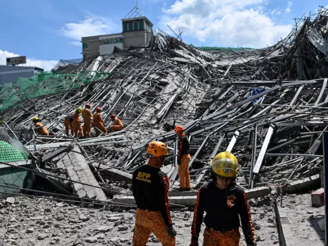 Rescuers search for more than 20 trapped after Philippines building collapse Rescuers search for more than 20 trapped after Philippines building collapse