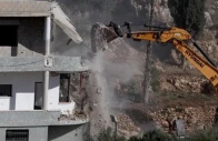 israeli construction equipment knocking down homes in lebanon photo anadolu agency