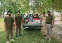 wildlife rangers stand beside a truck carrying confiscated items from poachers photo express wildlife rangers stand beside a truck carrying confiscated items from poachers photo express