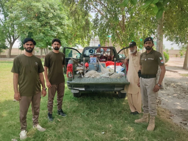 wildlife rangers stand beside a truck carrying confiscated items from poachers photo express wildlife rangers stand beside a truck carrying confiscated items from poachers photo express